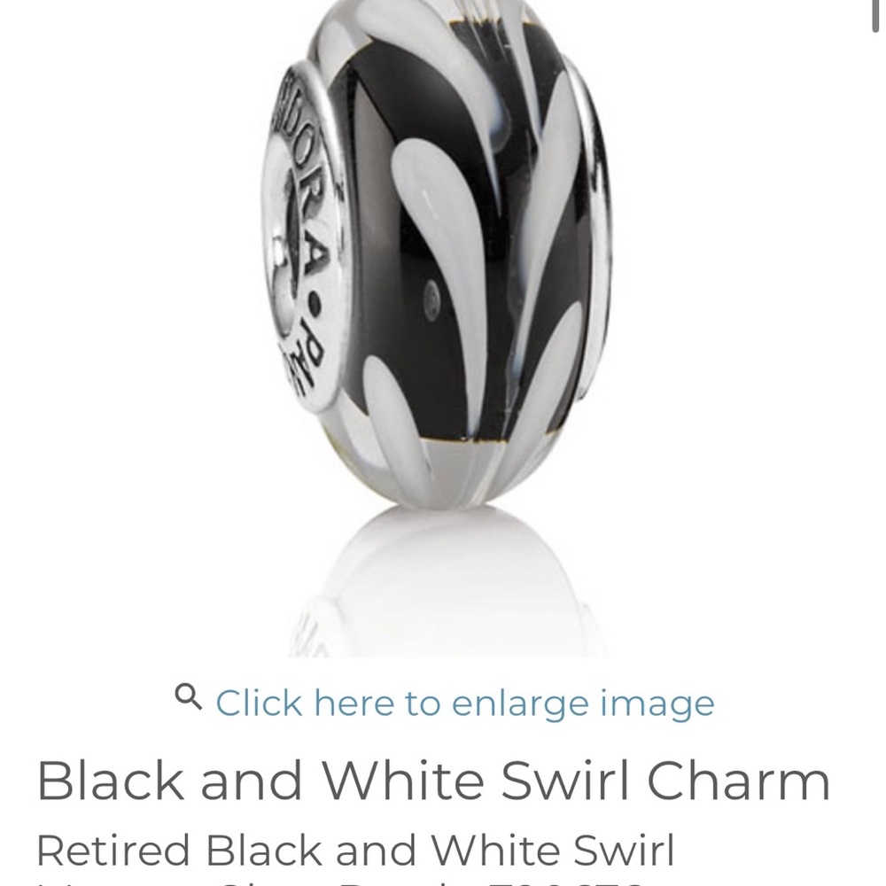 Pandora like new Glass charm white and black. Worn one time on necklace.
